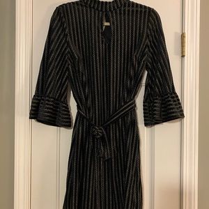 Black & silver keyhole dress w/ trumpet sleeves.